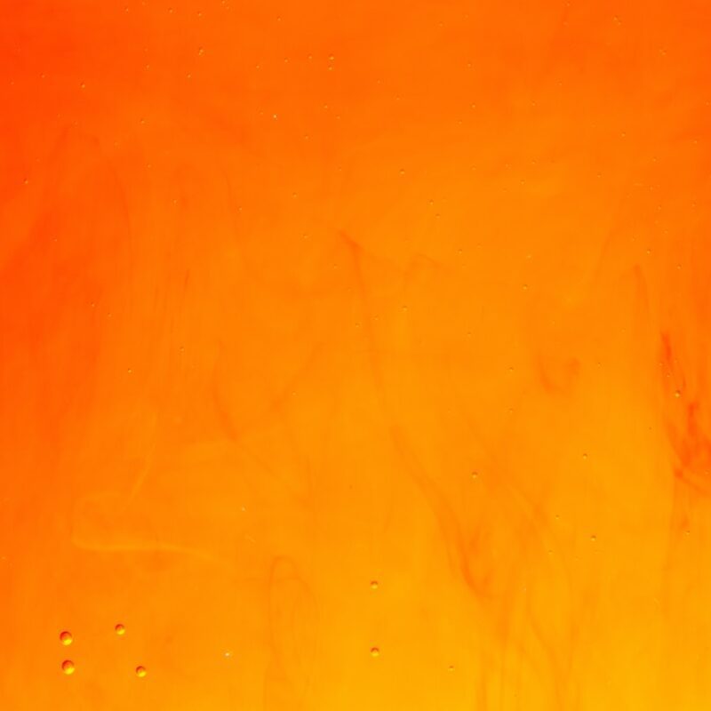 a close up of a fire with water drops on it